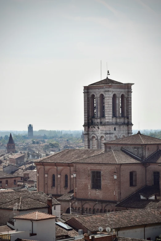 the rooftops of buildings and old bell tower