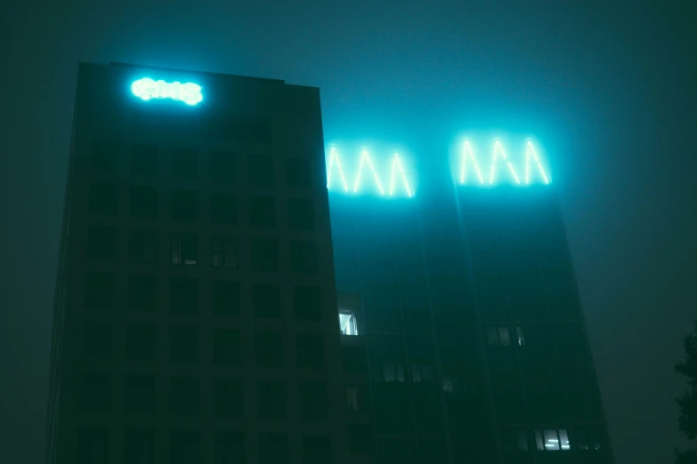 an image of illuminated neon signs on building at night