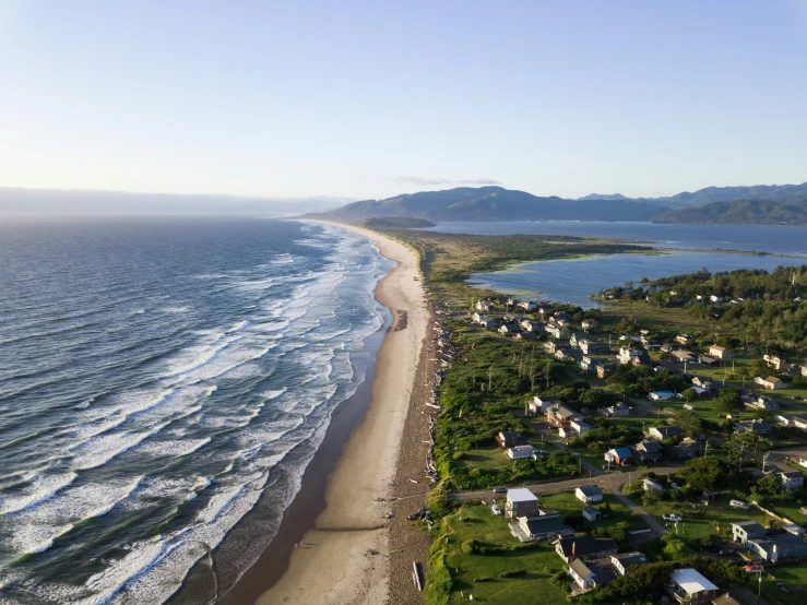 a beach is shown from a high above looking at the water