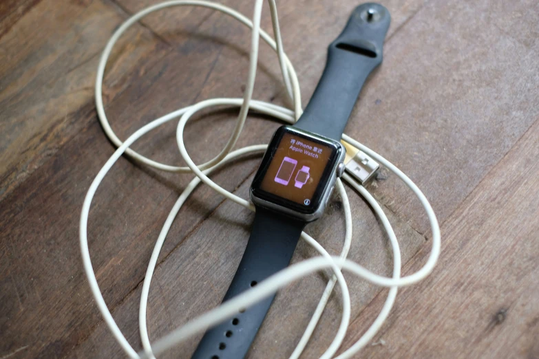 there is a smart watch connected to an apple ipod