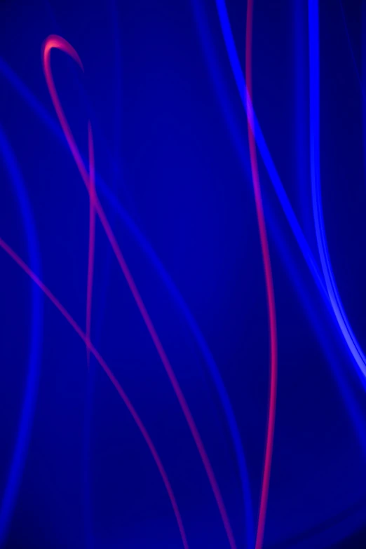 a blue and red wavy background with lots of light