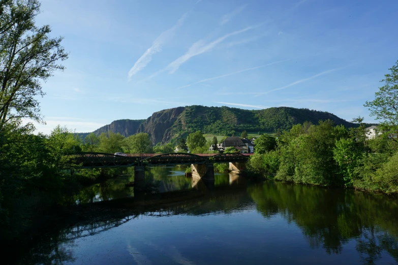 a body of water with a bridge next to it