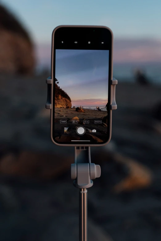 cellphone with smartphone showing landscape in foreground