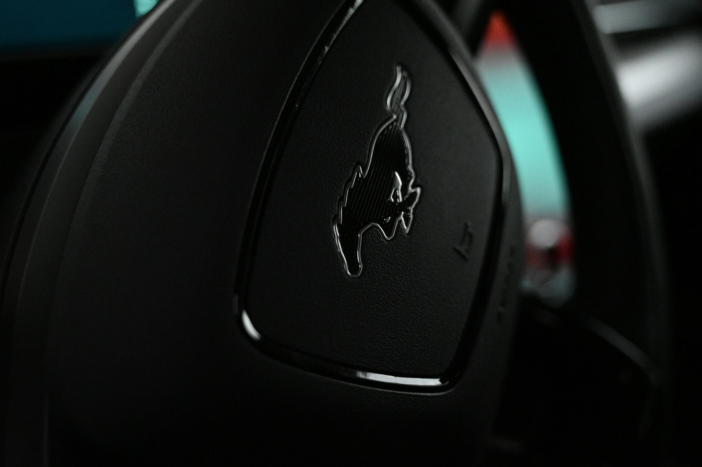 a dashboard on with the emblem of a horse