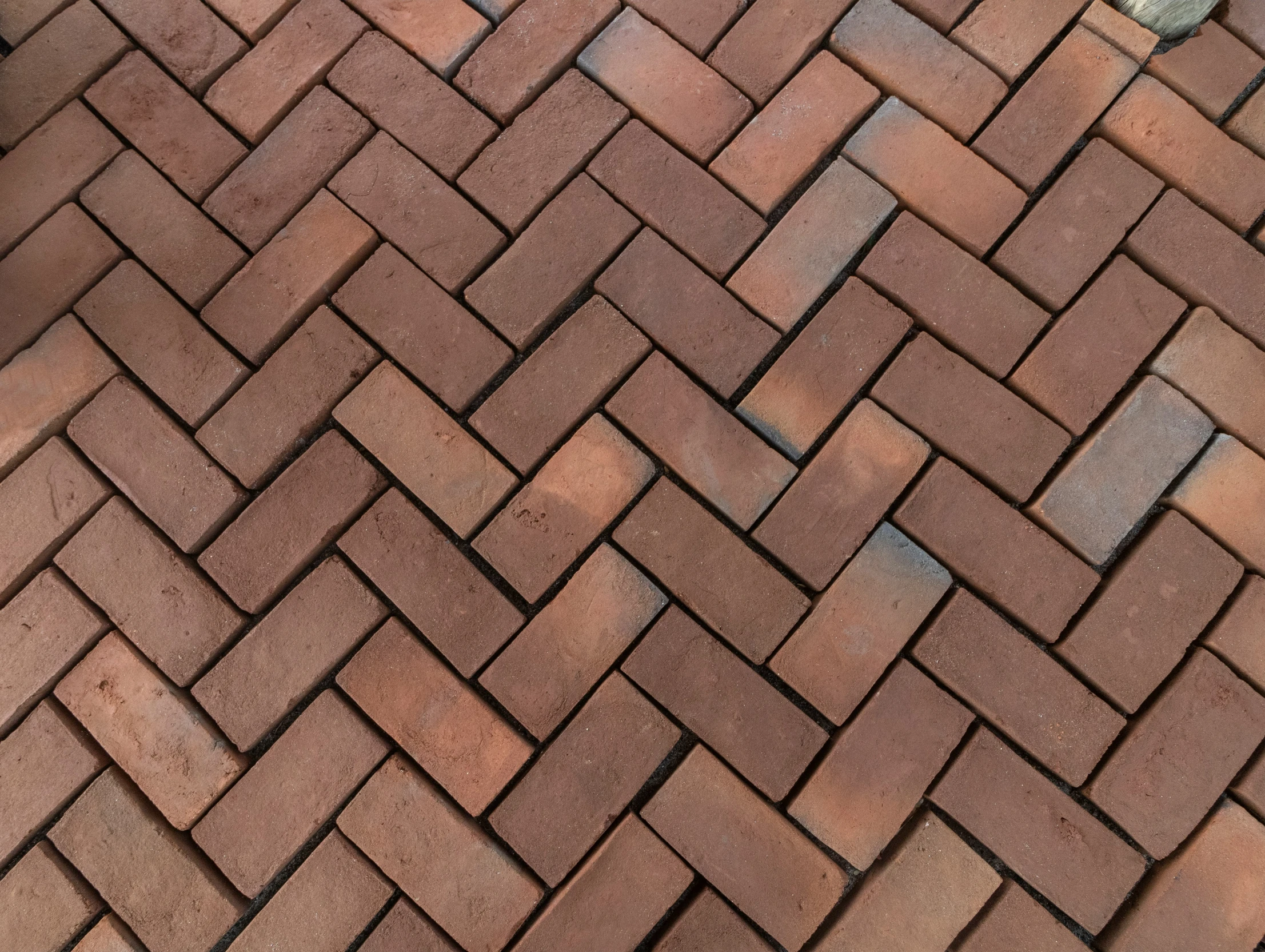 a red brick walkway with stone steps