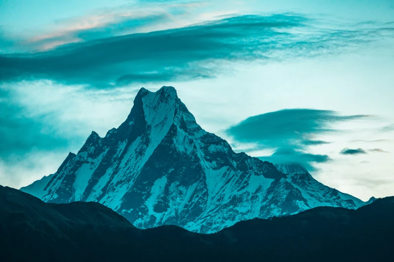 a very tall mountain with a sky background