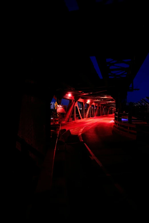 a train crossing over a bridge in a dark sky