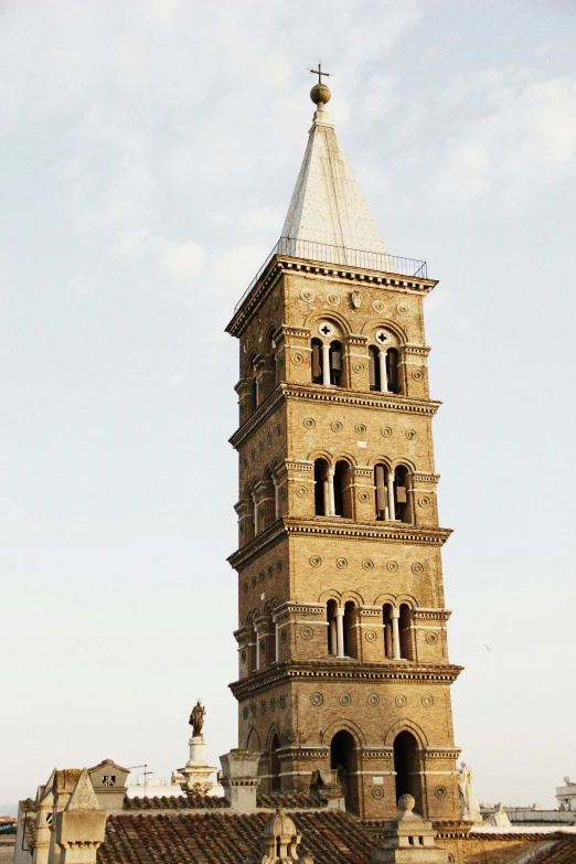 there is a tall stone tower with a clock on it