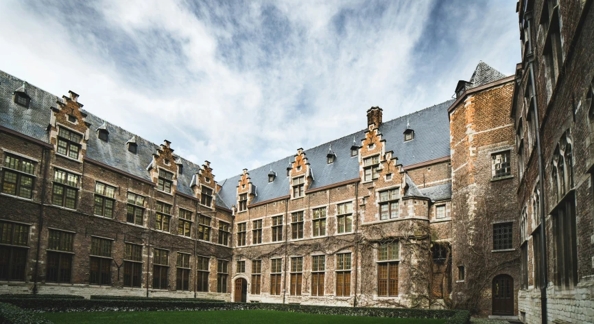 an old college building with some tall windows