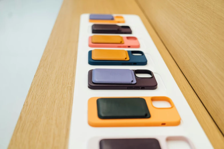 six iphone cases on display in a store