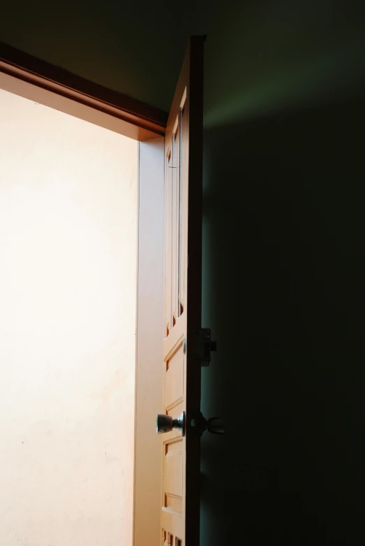 a door in an open door way in a wall