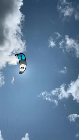 a kite that is in the air on a cloudy day