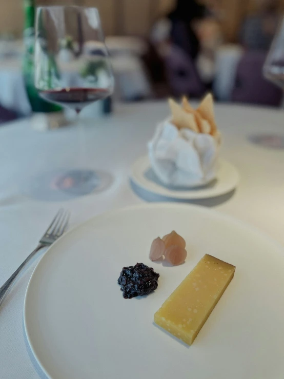 a plate with food that is on it near a glass