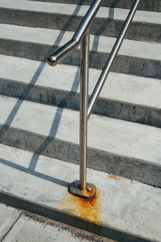 street railing and steps with a rusted surface