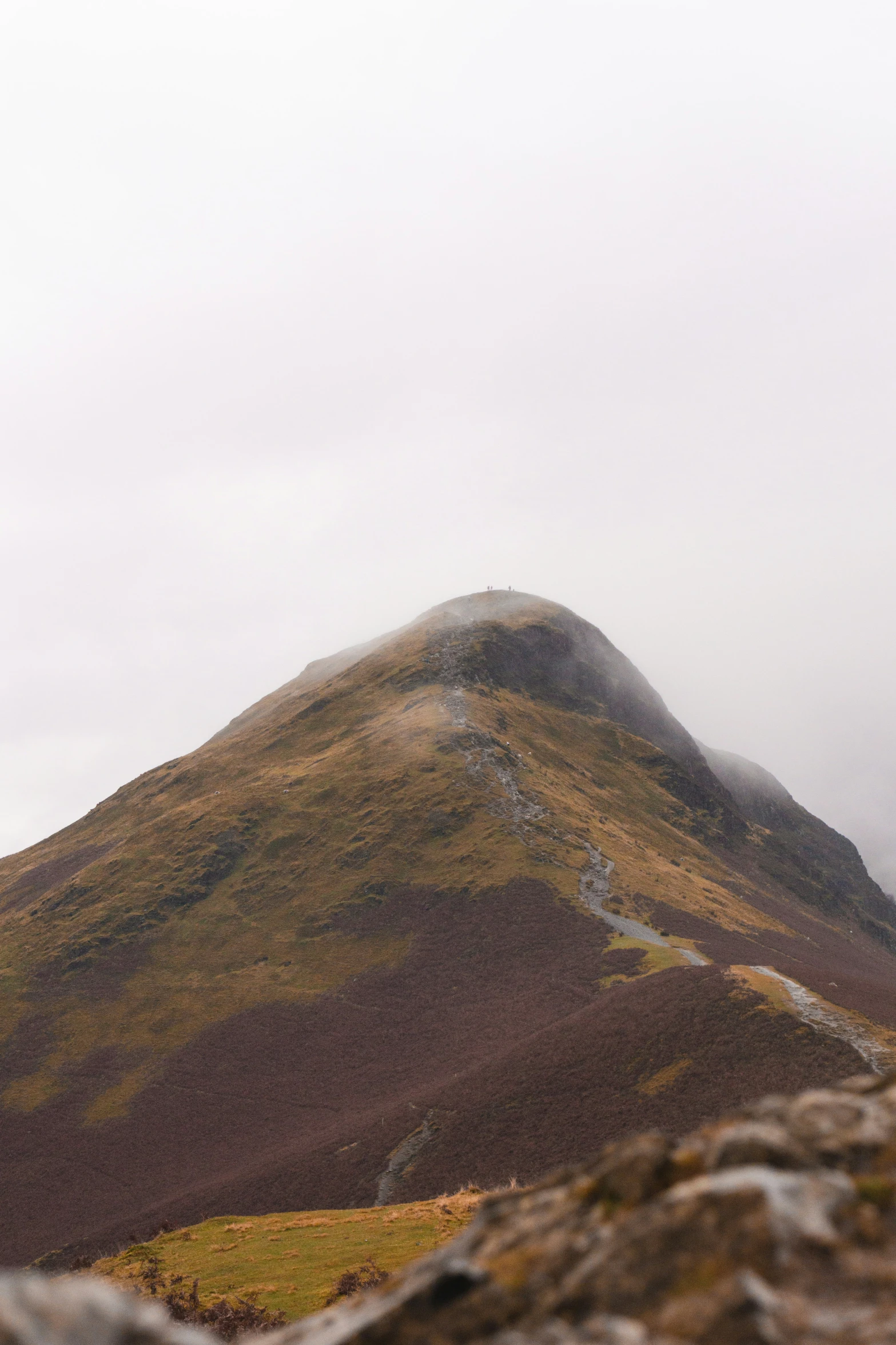 an open view of a mountain with a cloudy sky