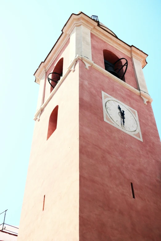 there is a red tower with a clock on it