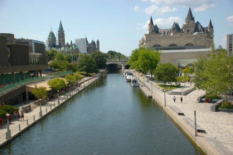 a canal going under a bridge in the middle of a city