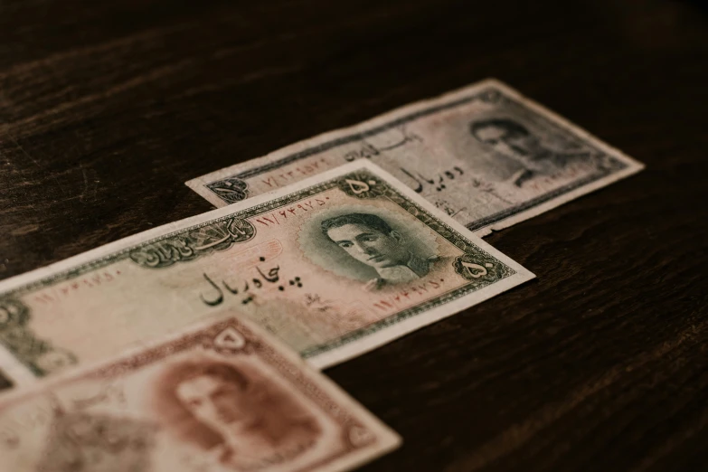 an old and new currency issued from pakistan