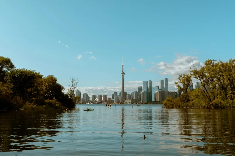 a view of a lake with the city in the background