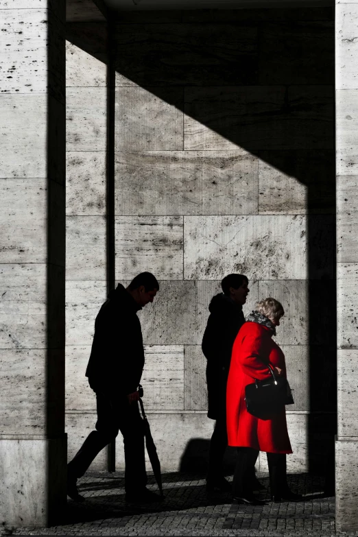 people waiting in line outside an empty building