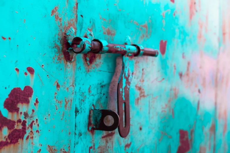 the door handle has been set into a blue and red wall