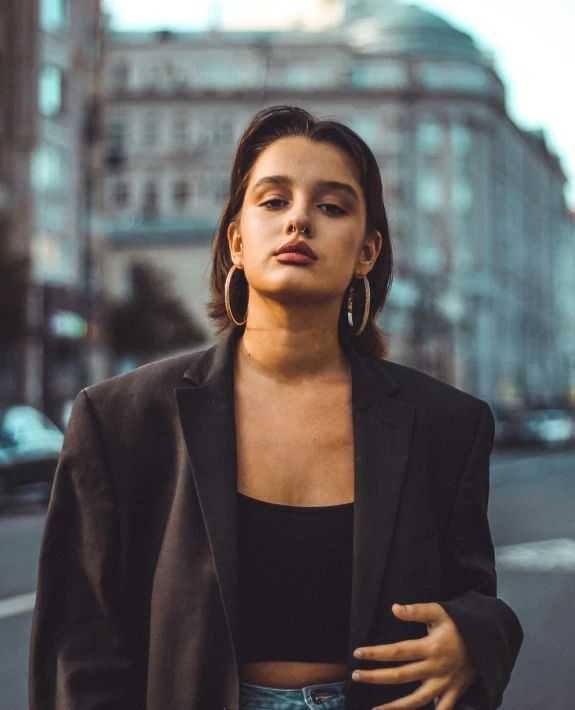 a woman standing in front of a city street