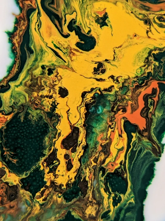 a close up image of green yellow and orange