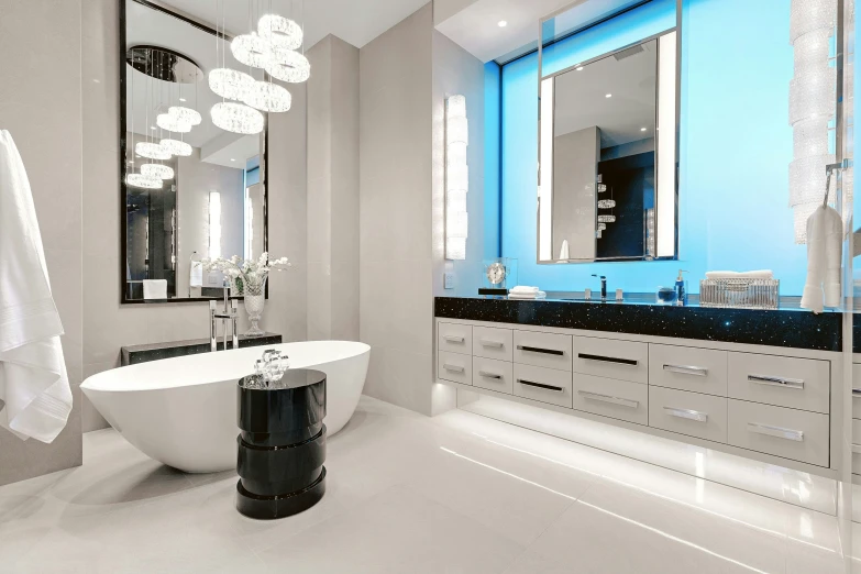 a black and white bathroom with a freestanding tub