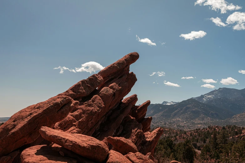 there is a rock tower high on the mountain