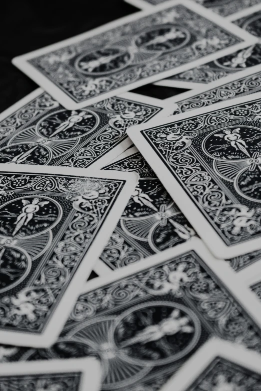 four deck cards laying side by side on a table