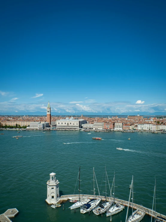 an aerial view of a marina with several sailboats