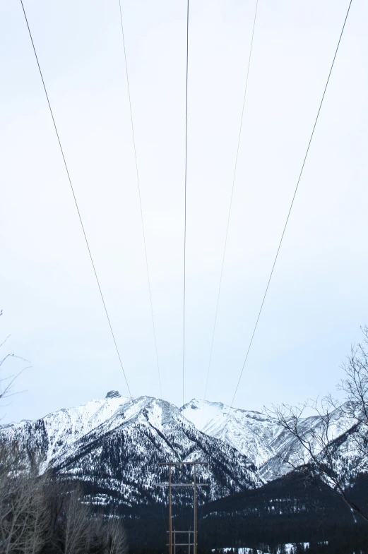 an electric line with mountains in the background