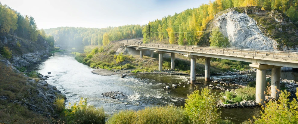 bridge crossing over a very small river with many bridges in it