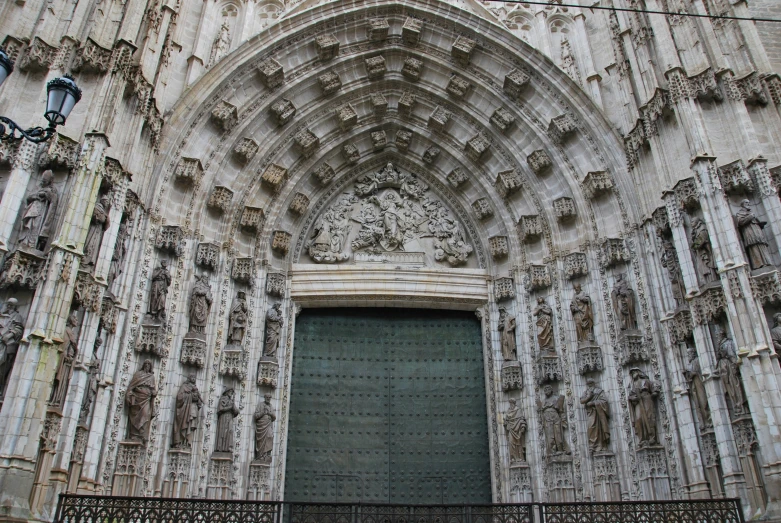 an ornate church with doors and ornate decorations