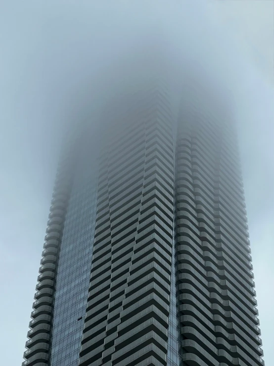 the tall building has fog on its face