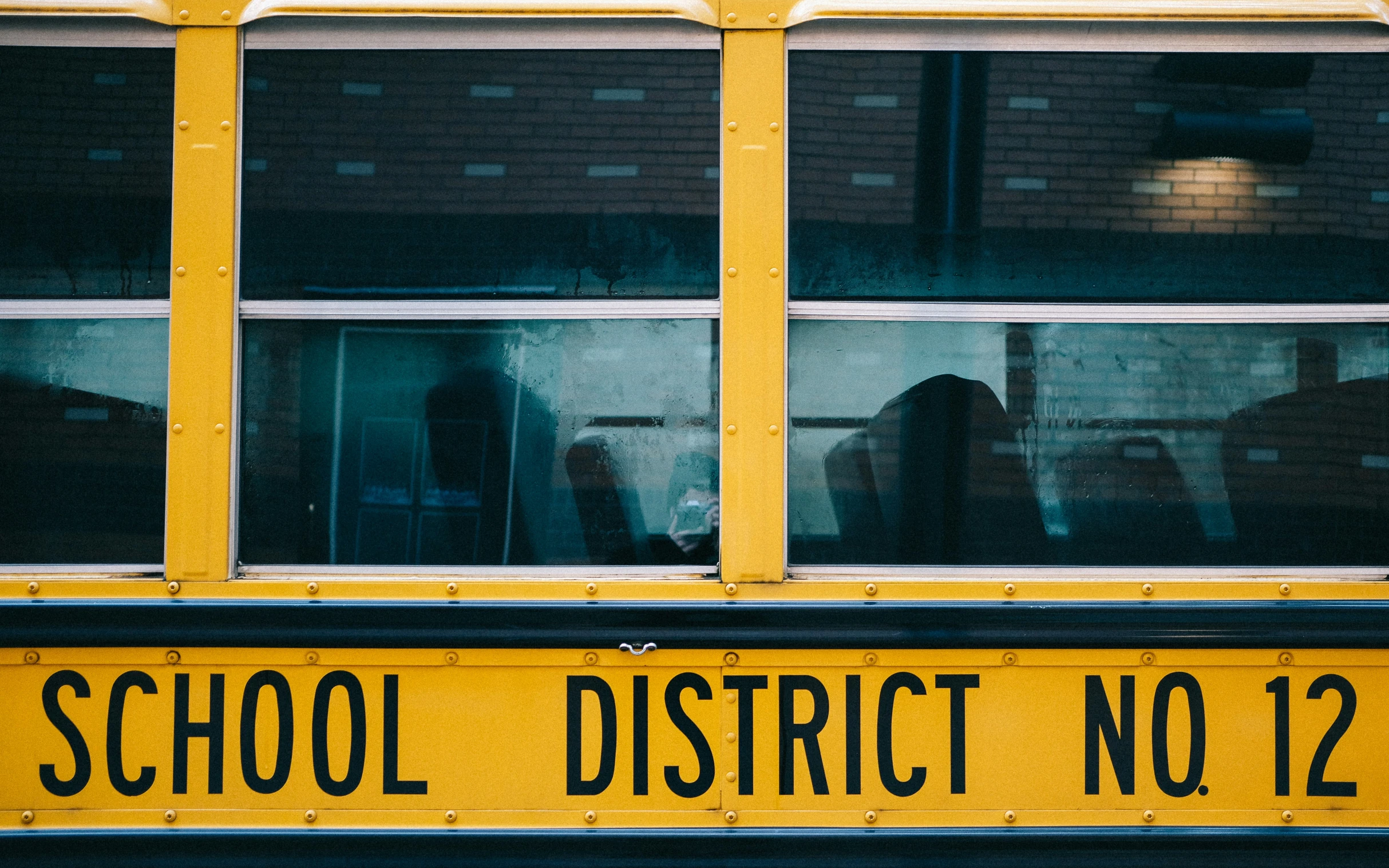 an old school bus with some windows and a sign that says school district no 124