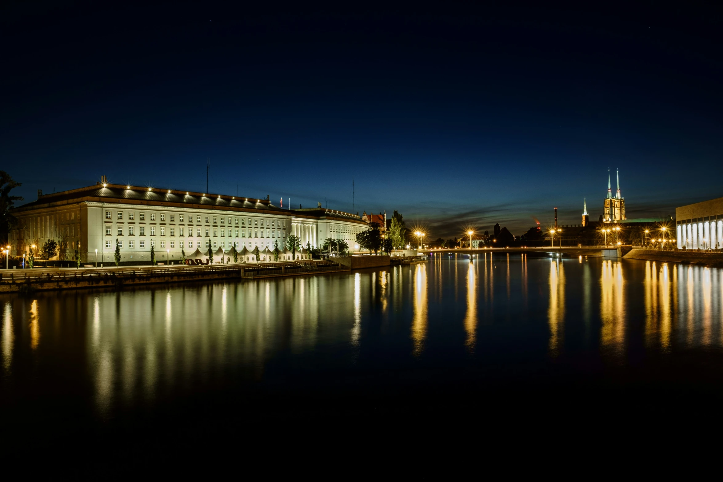 a night view of the city, across the water