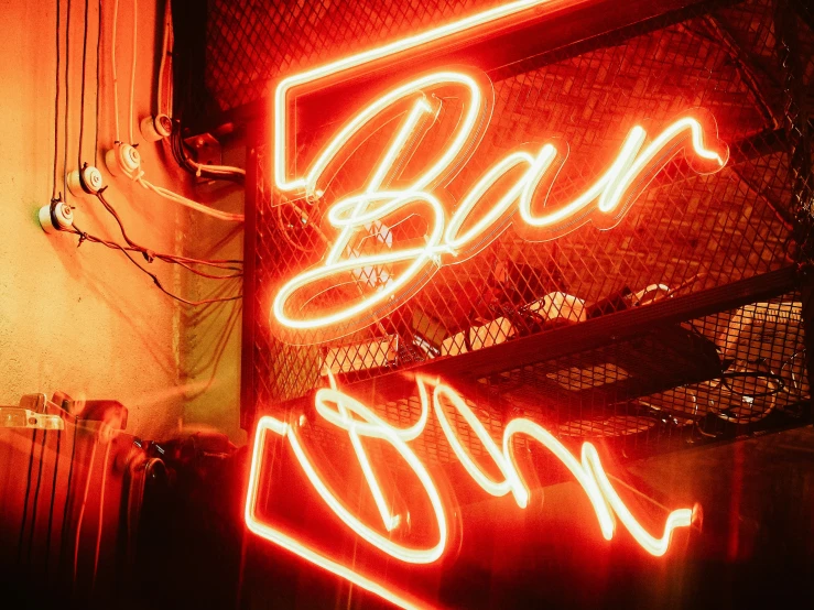 red neon sign in front of a restaurant