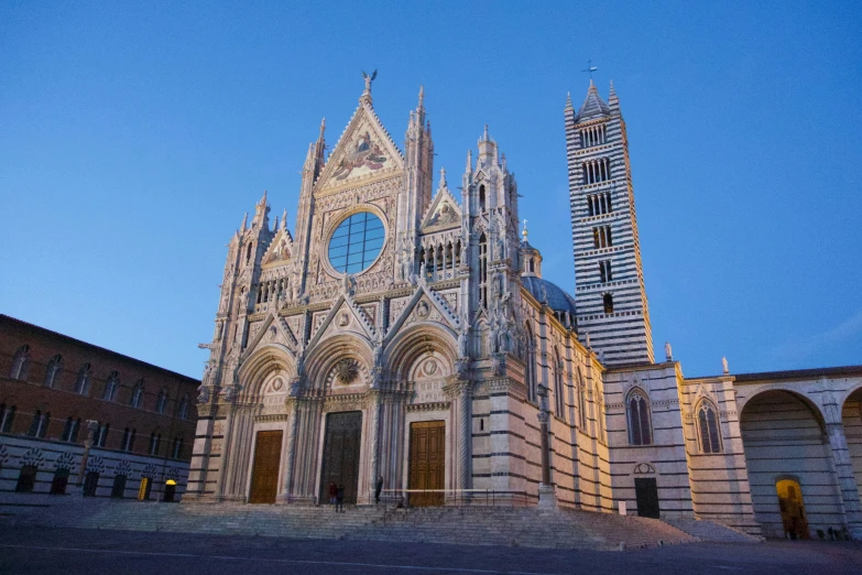 an old cathedral with two towers at night