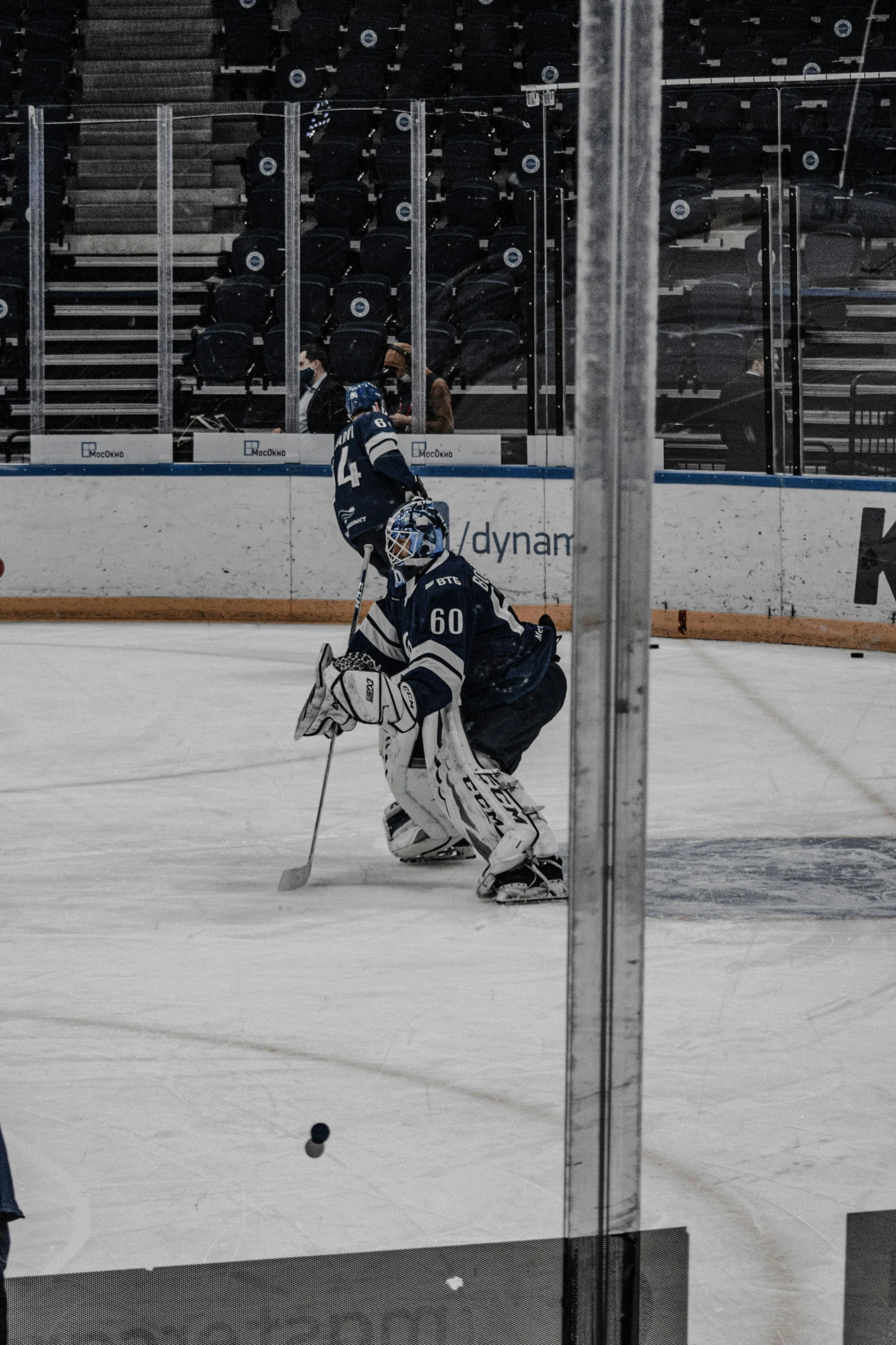 the goaltender has stopped to keep his face from getting hit by the puck