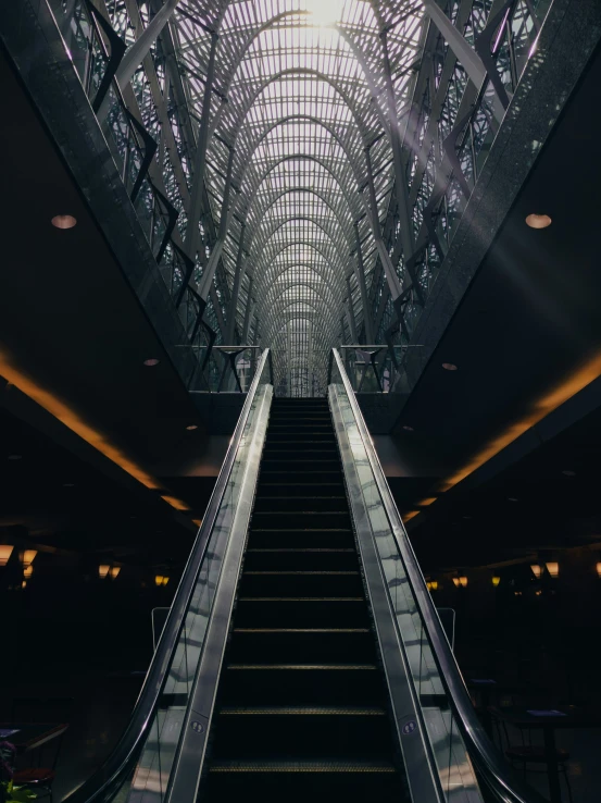 an escalator going through the middle of a building