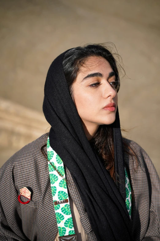 a woman with a scarf over her head