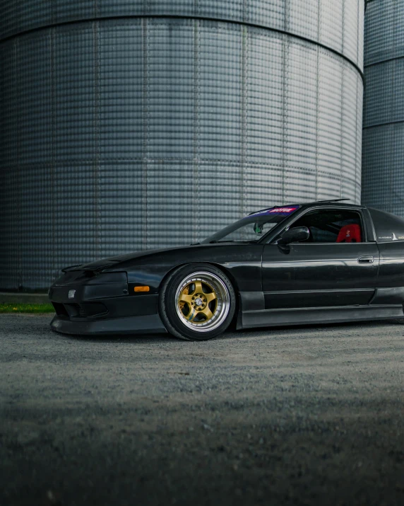 a black sports car in a parking lot