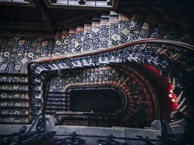 a stair way with a lot of patterned walls