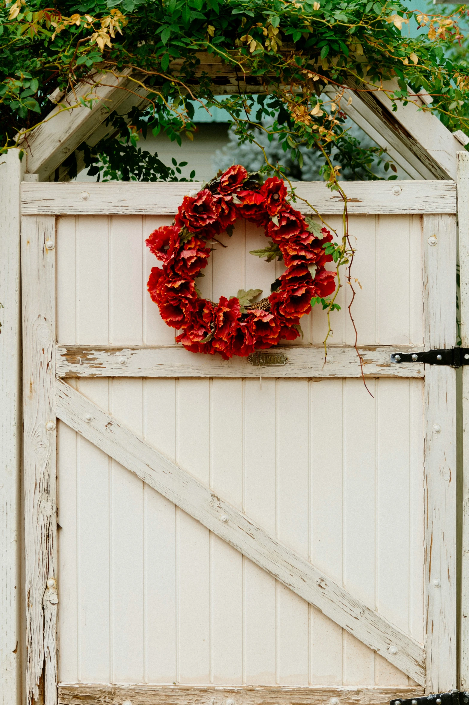 an open door with a wreath hanging on it