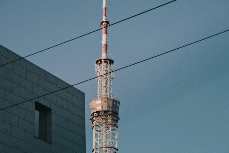 this is a po of an old and very tall building with wires in front of it