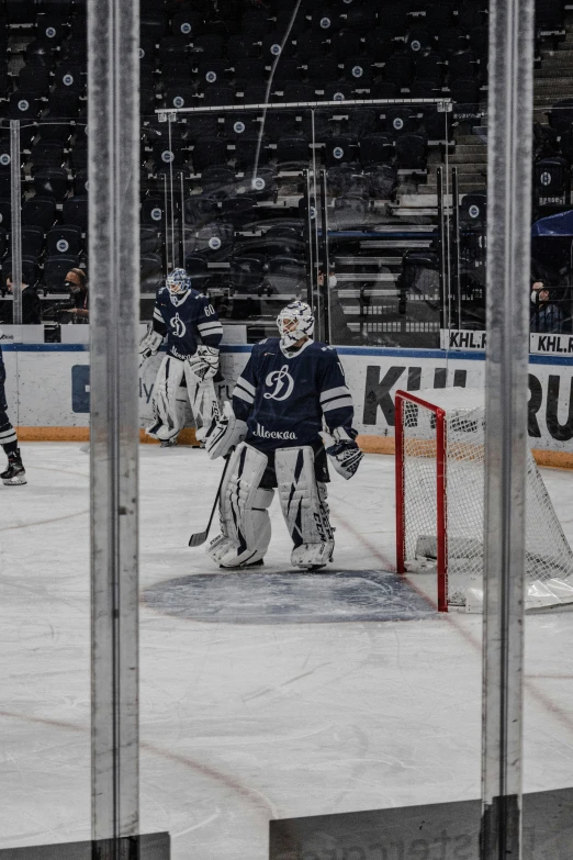 hockey players are playing on the ice during a game