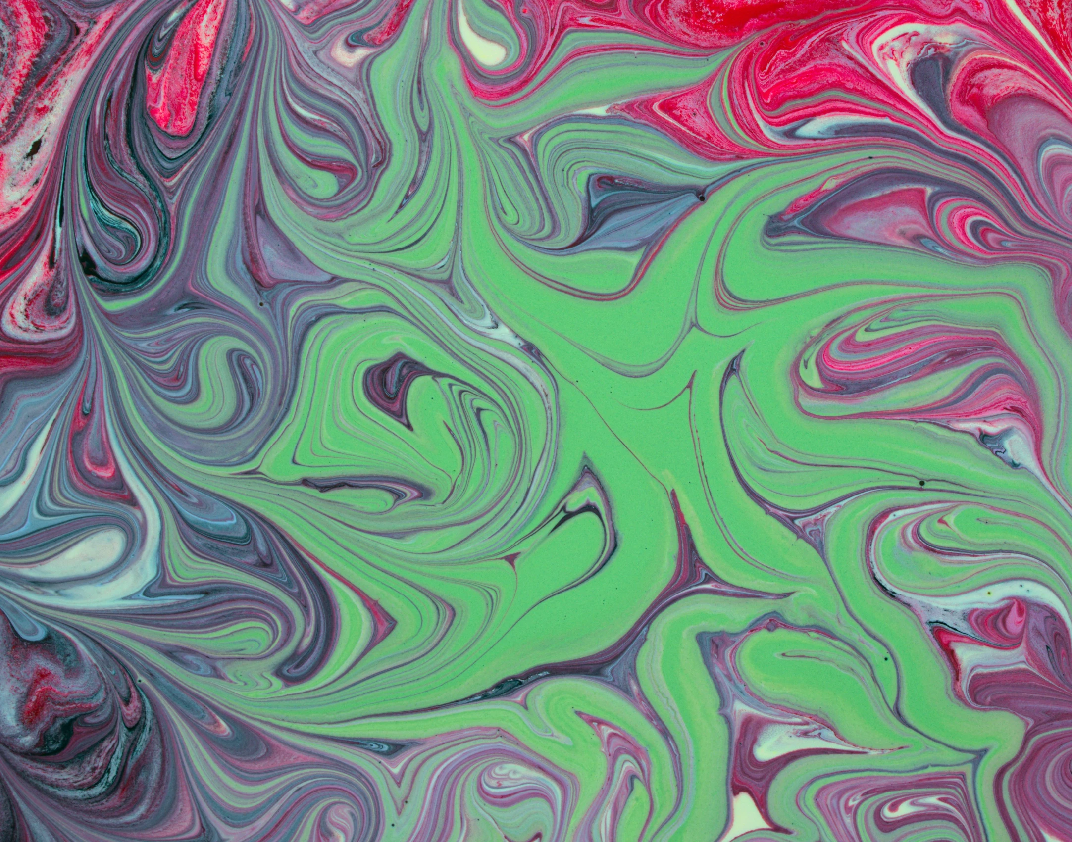 a picture of a colorful background made up of fluid swirling material