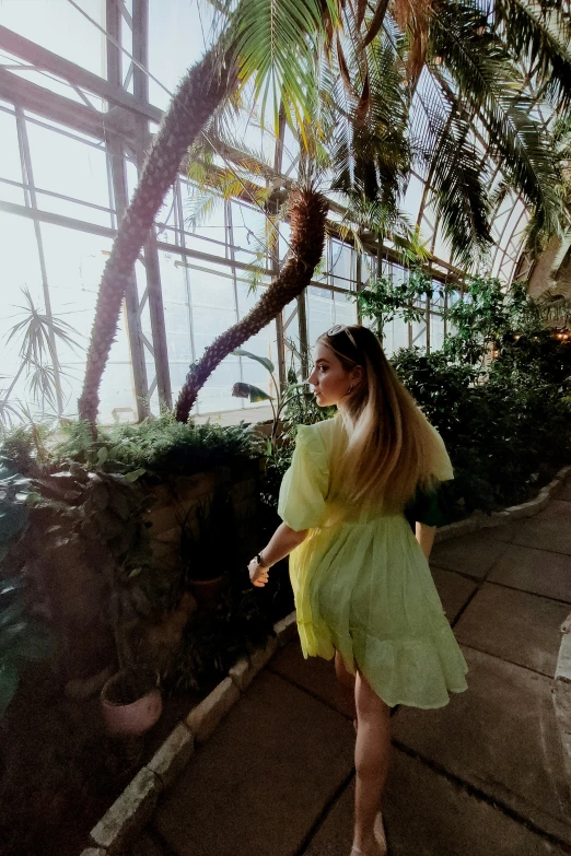 a woman standing on a patio with her  apart