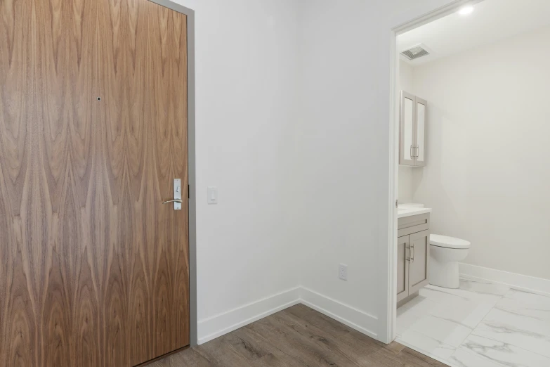 a view through two doors in a bathroom